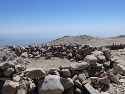 There are some pretty ornate tent shelters on the summit. Some of them are perched right on the edge of steep dropoffs. Must be an amazing place to camp in good weather, particularly if you have the summit to yourself.