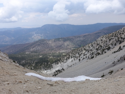 Now at the top of the bowl, there's a couple last little patches of snow. There had been som rain predicted for today, and it looks like the storm is just starting to roll-in.