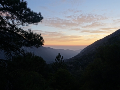 Almost sunset. I was hoping to avoid having to stop to put the headlight on, but it was getting hard to see when the trail went under heavy tree cover.