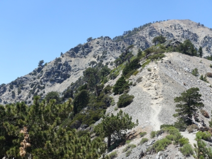 Turning around and heading back up the Backbone now. You can see the trail on the right, and then the dicey portion further back across the ledge on the left.