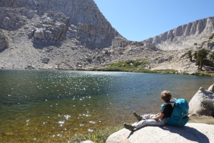 We made it to Lake 3. Aidan takes a break as he looks at the last ridge we have to climb to make it to Lakes 4 and 5 for the night.