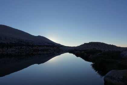 Perhaps one of my all-time favorite views. Lake 5 just seconds before the sun broke the ridge for sunrise. In sharp contrast to the night before, the water was smooth as glass.