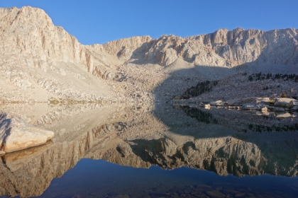 Check out the lower part of the photo. The water is so clear, you can see the rocks on the bottom while at the same time seeing the reflection on the surface. No polarizing filter used at all!