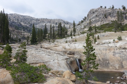 A further out view of the creek cutting through the granite to the falls.