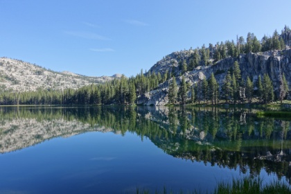 The sun is getting higher and in addition to the reflections on the water, you can see the greens from the bottom of the lake.