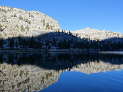 A little too much breeze for a perfect mirror, but still pretty close.