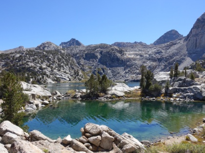 One lake flowing into the very beginning of the other. We had been looking for a campsite for a while now. We wanted to be on the upper Rae Lake so we were close to the junction of the Sixty Lake Basin trail and would have less mileage for the big climb up Glen Pass in the morning. There were very few possible sites in the area, but we found a spot right here. Was it too close to the trail? We didn't want to be those obnoxious guys setting-up our tent in plain view. But it was clearly an established site, and the spot was so amazing!
