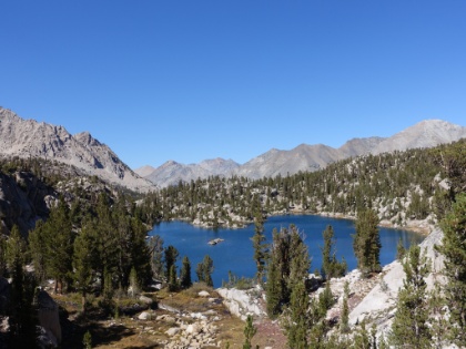 The trail fades out somewhere in this area, but we decide to scramble down to the next big lake.