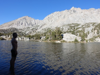 So about that island... Dustin had made it a goal to swim out to it and had been talking about it all afternoon. It's now almost 5:00pm and it's starting to get cold and really windy. The water temperature is  REALLY  cold. I doubt it was much out of the 40s. Probably not the smartest thing to do, but he was determined. And I was determined to only sit and take pictures! Here he is getting ready to start...