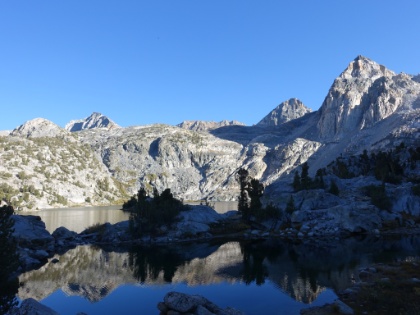 Back to our tent site as the sun is getting low. Dustin was shivering bad and looking pretty blue. I was more than a little worried. He put on every layer of clothes he had (including his down jacket) and stayed inside his sleeping bag for about and hour. Eventually he got out, jumped around a little to finish warming-up, and then was fine again. End to a  very  memorable day!