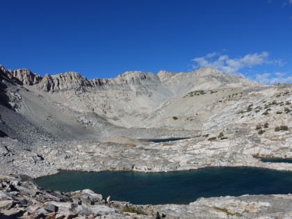 The trail hits a basin about halfway up to the pass. There's yet another amazing patchwork of lakes here. You can imagine this being a complete bowl of snow earlier in the year.