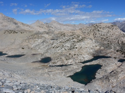 Almost up to the pass, and the lakes are endless below. You can also see snow glistening off the farthest peaks. Undoubtedly some of the small glaciers that still dot the highest peaks in the park.