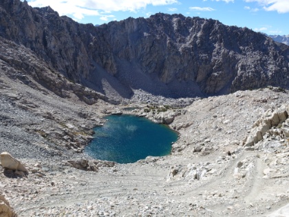 It was so cold and windy, we couldn't spend too much time on the pass, despite the amazing views. So we start heading down the other side. You can see the swtchbacks winding all the way down to the lake.