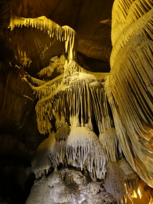 The stalactites form from calcium oozing through the marble. The stalagmites form from drops hitting the floor and building up over thousands and thousands of years. Looks like something out of an Aliens movie.