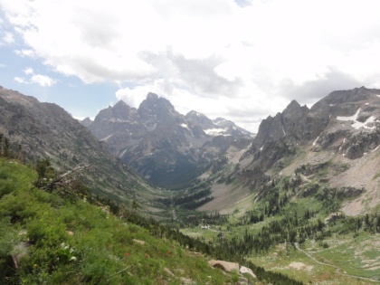 Another view down the North fork of Cascade Canyon towards the Grand Teton. It looks like an afternoon thunderstorm is starting to roll in again, and I'm getting worried about making it up and over the divide before the lightning hits. I meet a park ranger on his way down, and he confirms that the divide is totally exposed and is NOT the place to be when the storm hits. I either need to get over before it hits or wait it out on this side. I try to pick up my pace and press on.
