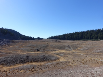 Looking back across the barren Wickiup Plains, which are technically a pumice plain. The miles seem longer when the trail is long and straight like this.