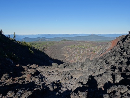 Near the top of the pass looking back down the switchbacks. It's much (much) steeper than it looks here. Also a good view all the way down the lava flow. And also a shadow selfie.