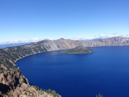 A little higher-up you can see how the crater forms a perfect bowl. The lake is at about 6,500' above sea level, and the peak of the mountain used to be almost 12,000'. After the volcano erupted over 7,000 years ago, the empty magma chambers caused the mountain to collapse. Lava sealed the cone allowing it to fill with snow and water.