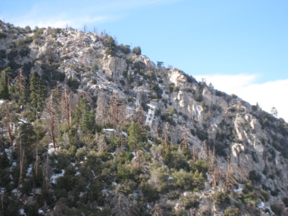 A zoomed-in view of a tram car, which you can see just passing the tower.