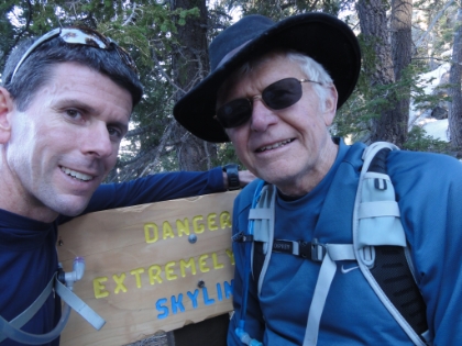 We made it! A self picture of us in front of the Skyline trail warning sign on the edge of Long Valley at 8400' above sea level, 8000' above our starting point, and almost 8500' of total elevation gain. Around 11 hours total time (about double my fastest solo time), but not bad for an old man!