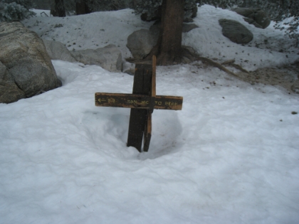 2.3m to go. It's starting to lightly snow and starting to get darker (though it's still middle of the day). I'm hoping the storm doesn't get too bad, or my summit hopes could be in jeopardy. Just past this point, I encounter a group of three Asian trekkers decked out in full mountaineering gear. They look like they know what they're doing. They're on their way down and they question me about proceeding on to the summit with the storm coming in. They ask if I have crampons with me (I don't). They ask if I have extra batteries for the GPS (I do). They ask if I have headlamp, etc. (I do). They ask why I'm starting so late from the tram station. I tell them I started from Palm Springs! They're shocked. I hear them muttering amongst themselves in Japanese. I guess they were satisfied I wasn't a complete novice and then proceeded on.