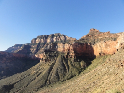 The layers of rock are amazing. Some interesting facts from my handy trail guide... The steep cliffs result from erosion of harder rock layers while the more sloped areas result from erosion of softer rock. The topmost layers are around 270 million years old while the layers all the way down at the river are 1.7 billion years old. Each step you take down the South Kaibab trail is equivalent to 100,000 years of time!
