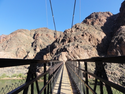 Heading across the South Kaibab suspension bridge, also known as the Black Bridge, built in 1928. Each of the 8 main cables is 550' long and weighs more than a ton. Each one was snaked down the trail by 42 laborers spaced along the cable. Prior to the bridge there was a gondola crossing, and prior to that it was by boat only.   The foreman of the trail and bridge construction project was killed during contstruction of the trail and his grave is evidently somewhere along the trail near the river. I doubt the National Park service would have the budget to pull off something like this nowadays.