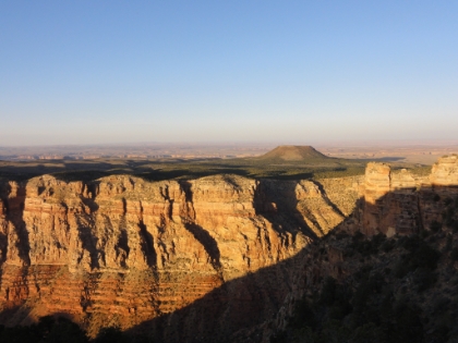 A look at the cliffs called the Palisades, the light across the plateau, and the almost man made looking mountain on top.