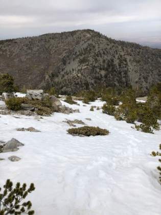 Heading back down, following my own prints.