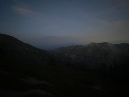 Top of the bowl looking back down at the Notch and the glowing lights of the ski lodge.