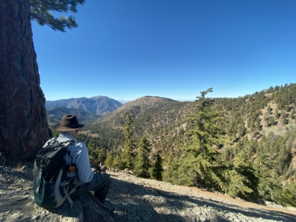Taking a quick break looking out over the meadow below.