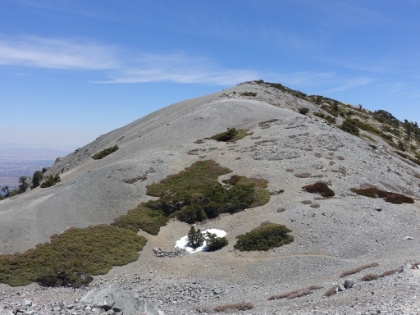 Heading back down now, I decide to take a quick detour up neighboring Mt. Harwood. There's just a couple last patches of snow here in early June.