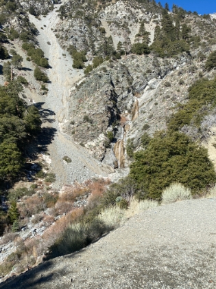 The waterfall is low but still flowing.