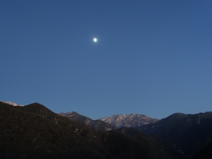 The camera makes the sky look brighter than it is, but the moon is already high in the night sky.