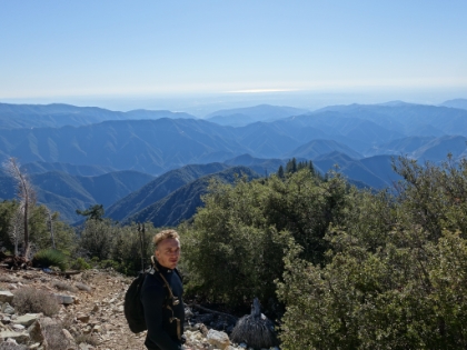 It's a really clear day and the view stretches from the mountain range, across the city below, and all the way to the ocean.