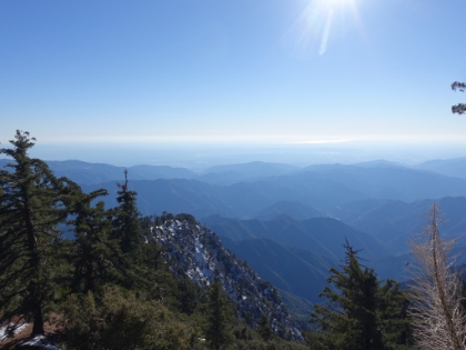 Looking back along the ridge and trail, the snow is noticeably heavier on the North face of the slopes.