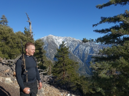 Almost to the summit, snowball in hand, with Mt. Baldy in the distance.