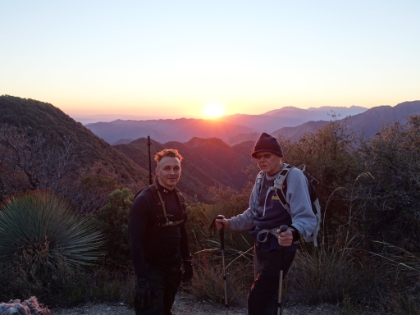 Back down to the saddle just as the sun is about to dip below the range.