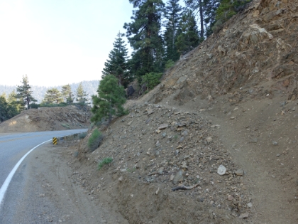 After a while, I rejoined what I thought was the PCT. The ridgeline looked similar, but things just didn't feel right, and I seemed to be heading too far North. I finally pulled-out the map and realized I must have come over Throop Peak and ended-up on the Dawson Saddle trail. By the time I realized this, I was almost all the way down to Highway 2. Here's the trailhead at the highway. Unfortunately, my blunder ended-up adding 3.6 miles and 1,800' of gain to the day when I was already getting tired and low on water.