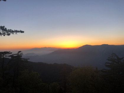 A few seconds later and it's gone. It's amazing how fast the sun moves when it's that low. The light of sunset with the hazy mountains was a cool look. But I still had almost 6 miles to go and light was fading fast.