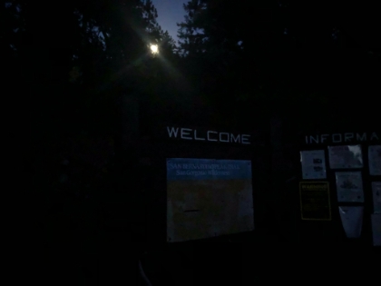 Full moon peeking through the trees as I get back to the trailhead in the last rays of light before needing the headlamp. A long but great day!