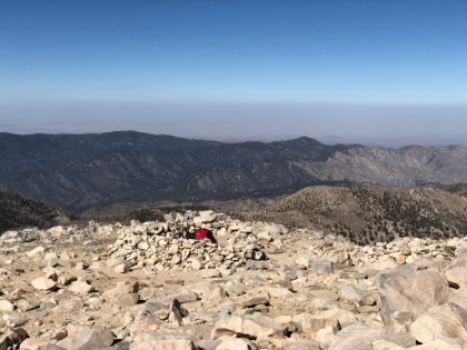 The only person I saw on top. Must be a great place to camp. But the wind is howling up here and the temperature with wind chill is in the low 20s. I wonder if that's a TV antennae or what?