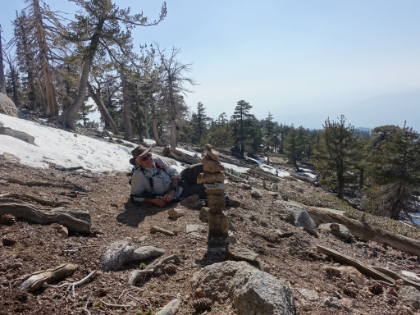 Made it back to Dad right on time! Evidently he was almost eaten while he was sleeping by a hawk that thought he was a carcass. Here he poses with a cairn he created while I was away.