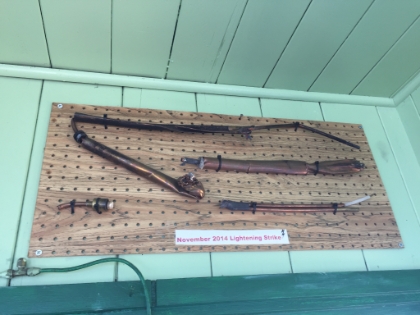 Evidently they had just installed a new lightning rod on the tower in 2014 when it got struck, completley mangling the copper pipe. But the rod worked!