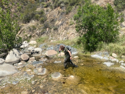 Dad decides to take the easy way by wading across this creek. I on the other hand decided to go for a little swim. The light brown stuff on the rocks is some sort of moss and it's slick as ice. I wiped out, plunged into the water, and then wiped out a couple more times trying to get up. I was drenched, but fortunately it was a warm day.