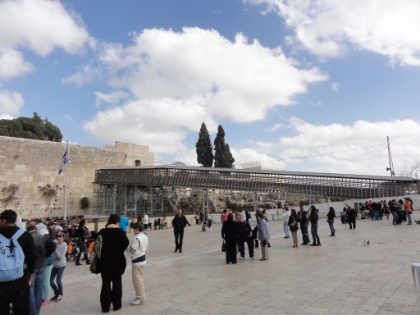 The Mughrabi bridge which gives vistor access to Temple Mount during select times of the day. It's controlled by the Jewish quarter but gives access to the holiest location in the Muslim Quarter. This was supposed to be a temporary bridge but working on it is so controversial that it has not been replaced.