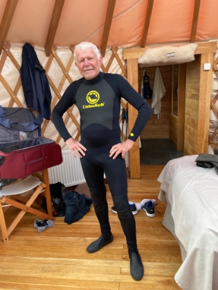 Our excursion for the day is kayaking on Lago Toro. Here Dad shows off his wetsuit, which is required for kayaking on the ice cold glacial lake.