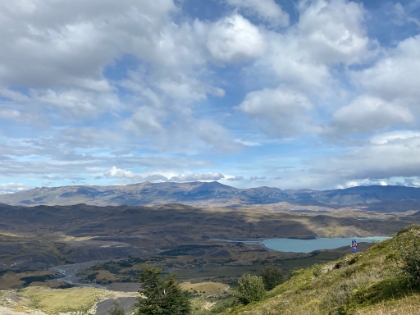 A late afternoon view of the valley and Laguna Armaga below as a lone hiker heads up the trail.