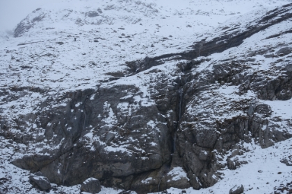 Misleading in the picutre, but these waterfalls are several hundreed feet high, cutting a narrow gorge in the cliff face.