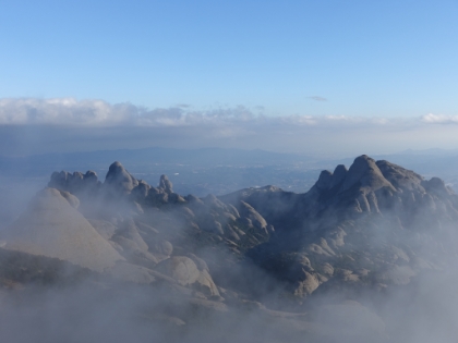 The last wisps of cloud drifting over the serrats.